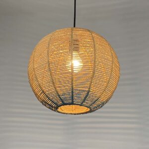 Handwoven raffia pendant light with a round woven shade providing warm ambient lighting for living rooms, bedrooms and dining areas.