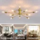 Brushed brass starburst semi-flush mount ceiling light with multiple decorative bulb arms.