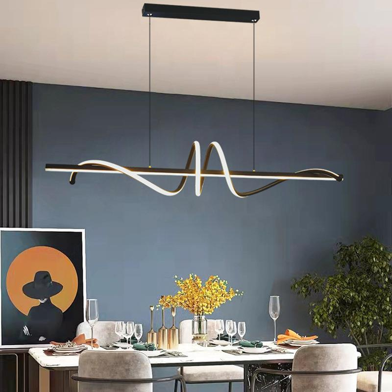Modern luxury linear wave LED pendant light above dining table