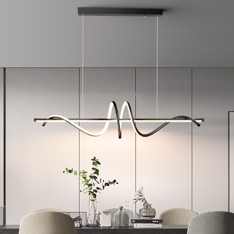 Modern luxury linear wave LED pendant light above dining table
