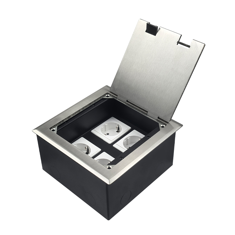 Recessed hidden stainless steel floor socket junction box with hinged cover and four socket module openings.